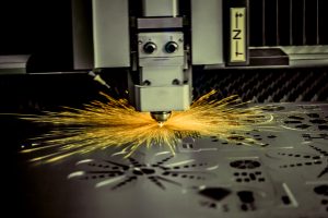 CNC Laser cutting of metal, modern industrial technology.