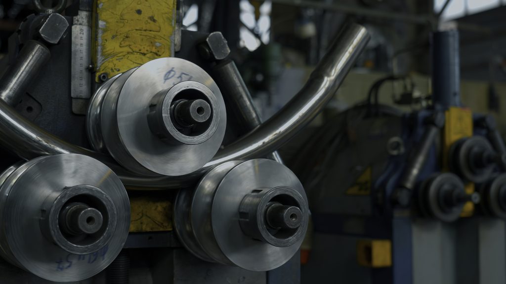Industrial bender equipment machine for metal pipe bending in the factory.