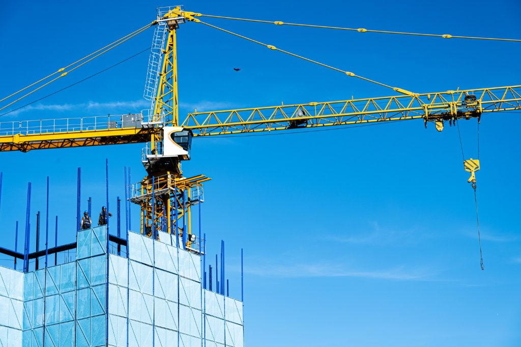 Building construction site and tower crane - Construction Industry